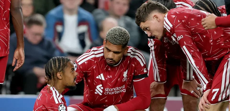 Liverpool players discussing during a match huddle