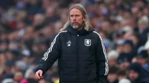 Manager on the sideline during a match