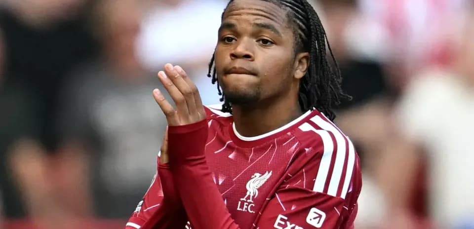 Player clapping while wearing Liverpool jersey