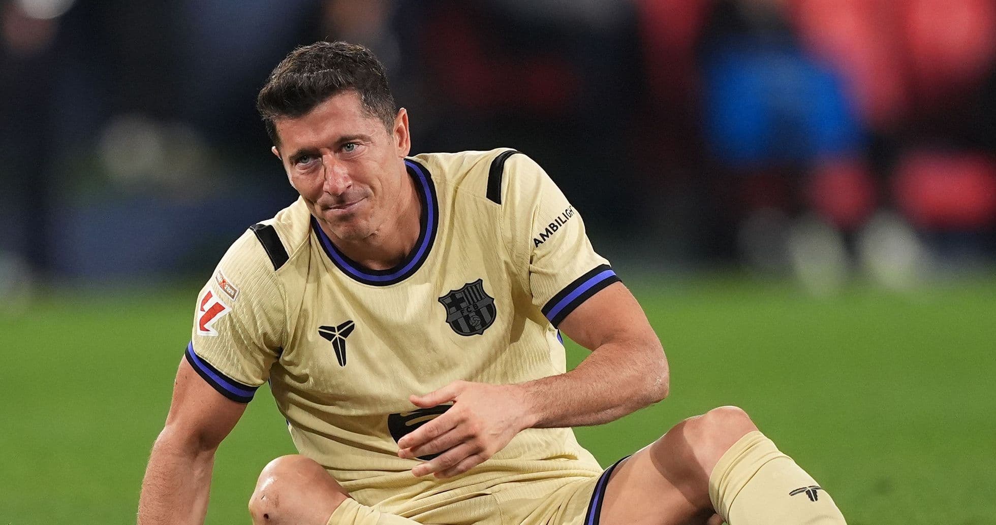 Player sitting on field after play during match