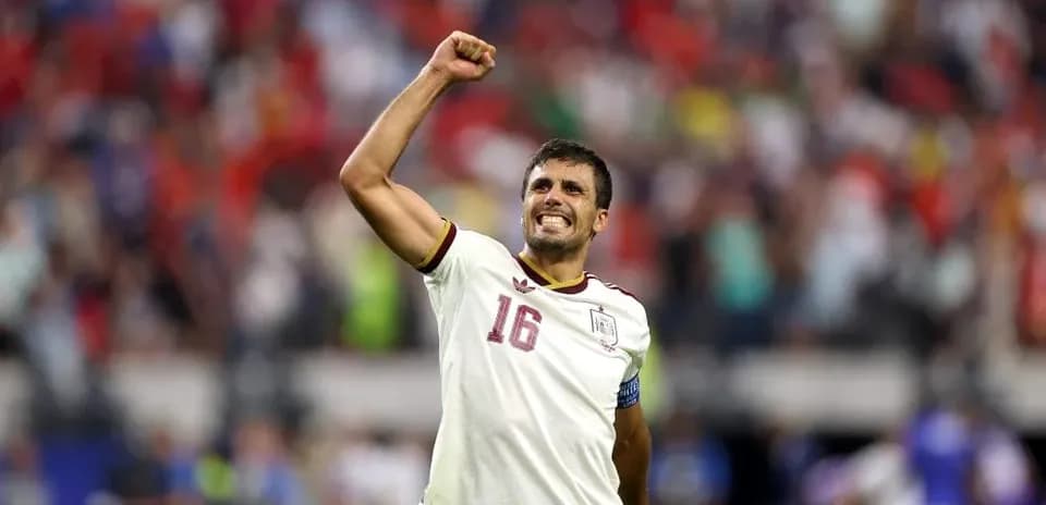 Player celebrating with fist raised after victory