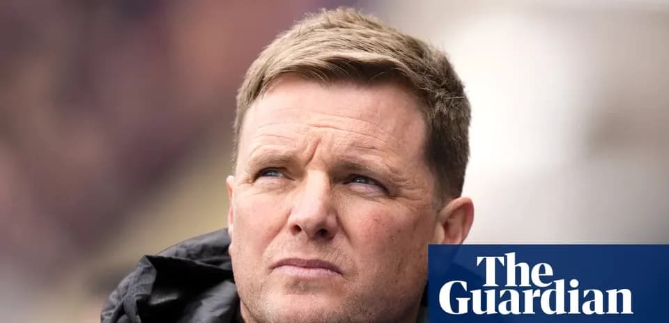 Football manager looking on during a match