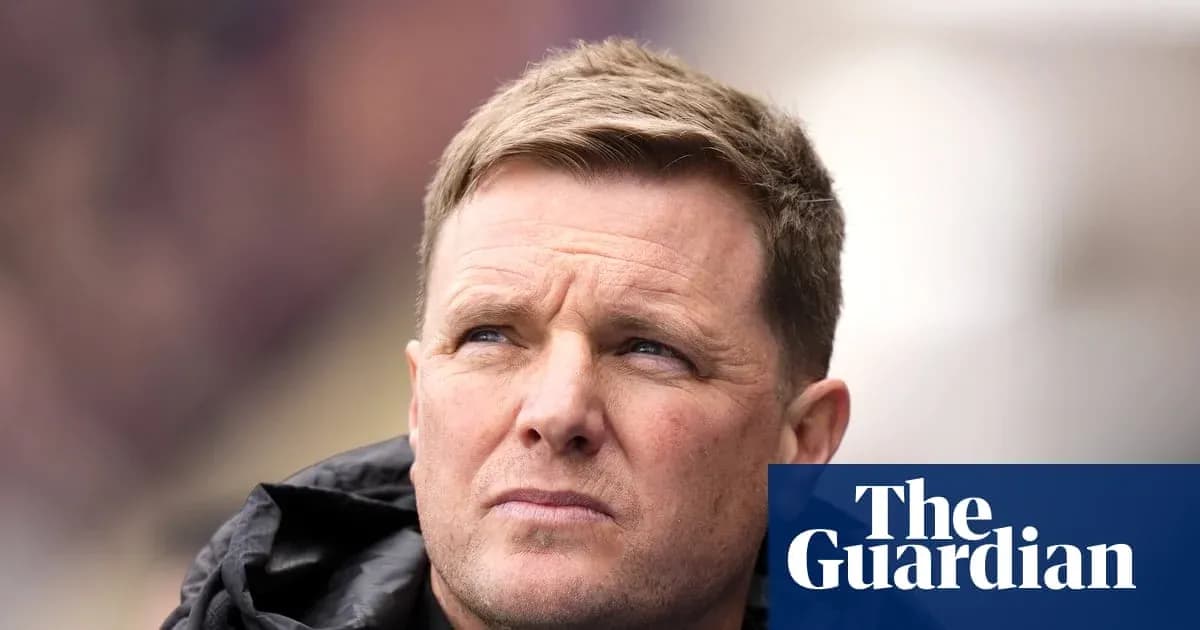Football manager looking on during a match
