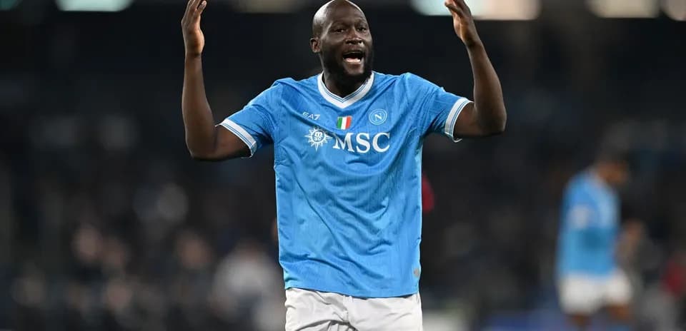 Player celebrating in Napoli's blue home jersey