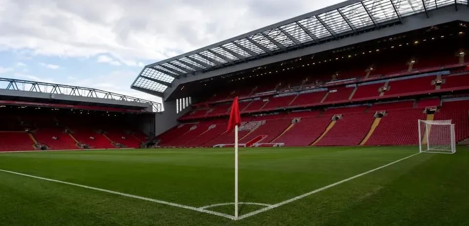 Corner flag at Anfield stadium with empty stands