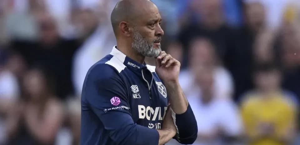 Manager contemplating during a football match