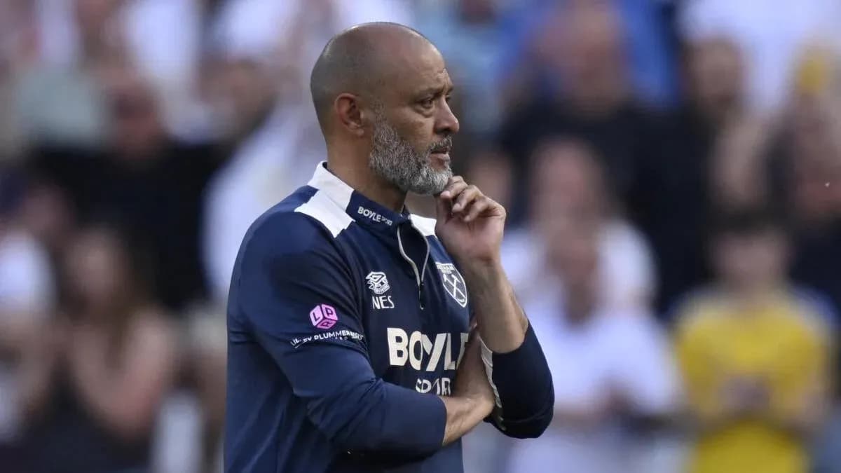 Manager contemplating during a football match