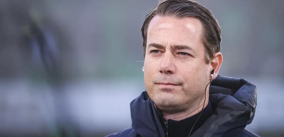 Coach wearing earphones during match preparation