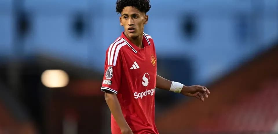 Player in red Manchester United kit on the field