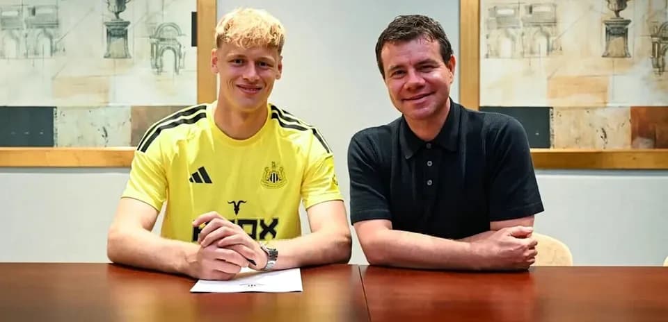 Player signing contract at club office with official
