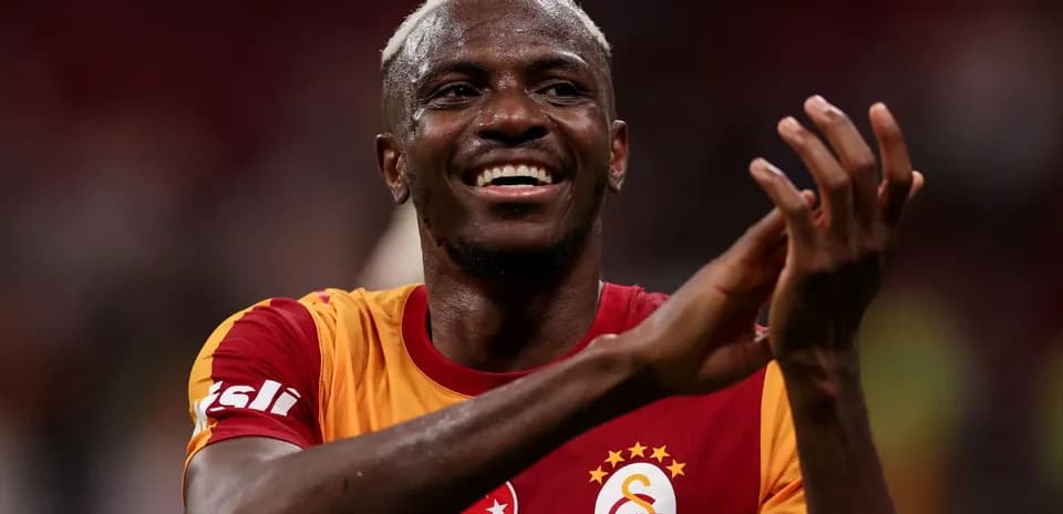 Player celebrating after a match wearing Galatasaray jersey