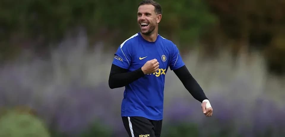 Player smiling during training session in blue kit