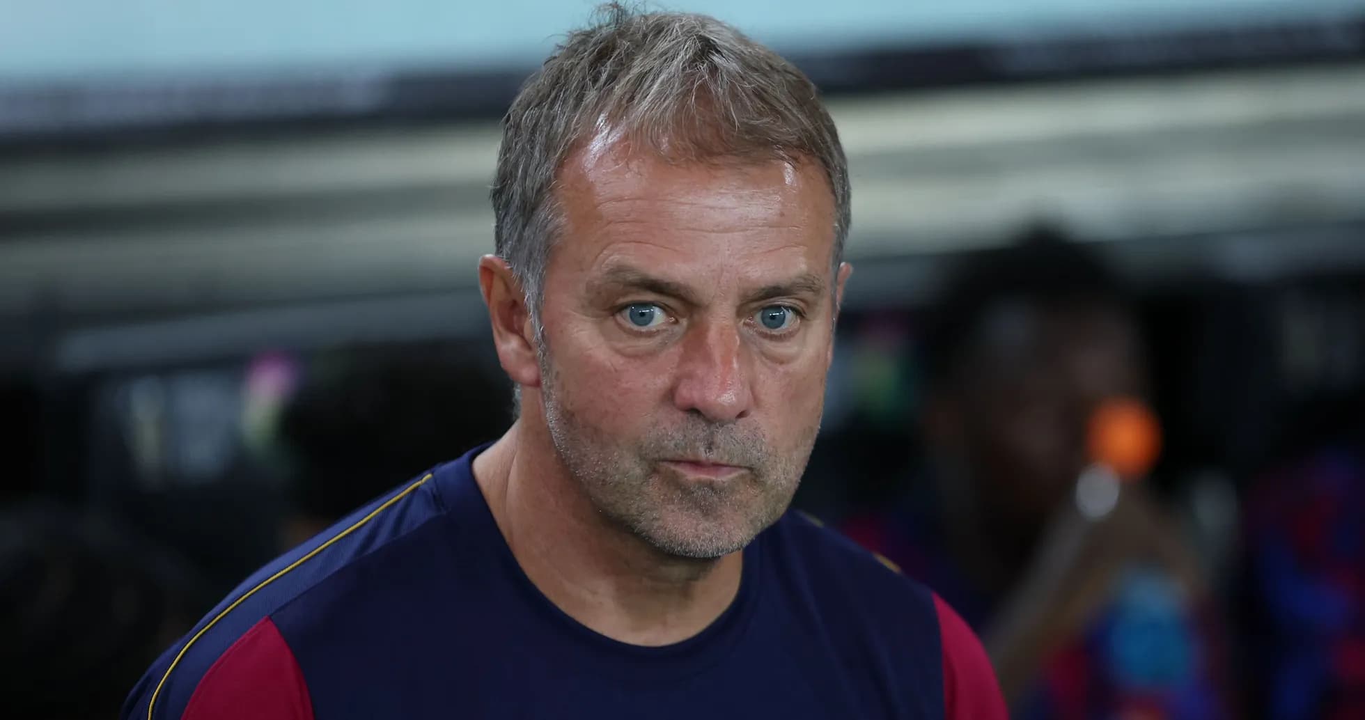 Coach sitting on the bench during a match