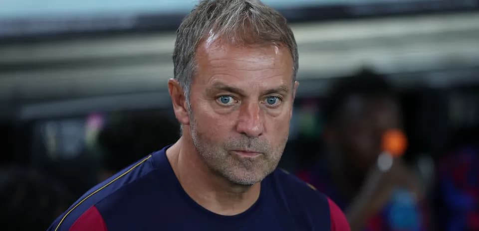 Coach sitting on the bench during a match