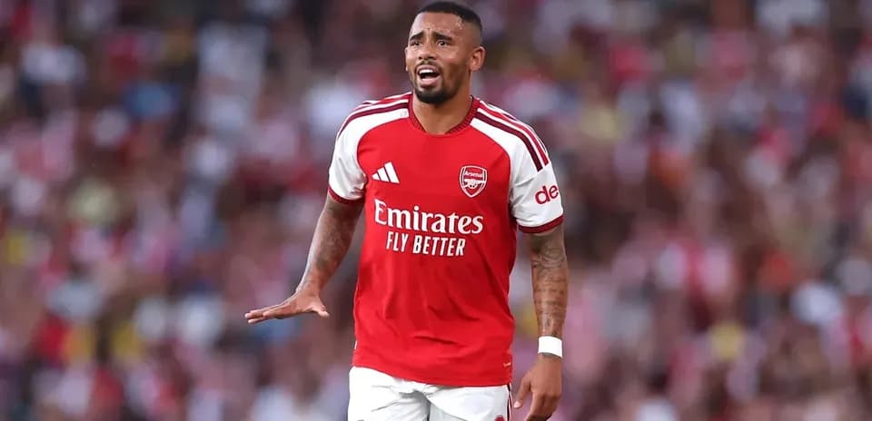 Arsenal player gesturing during match at stadium