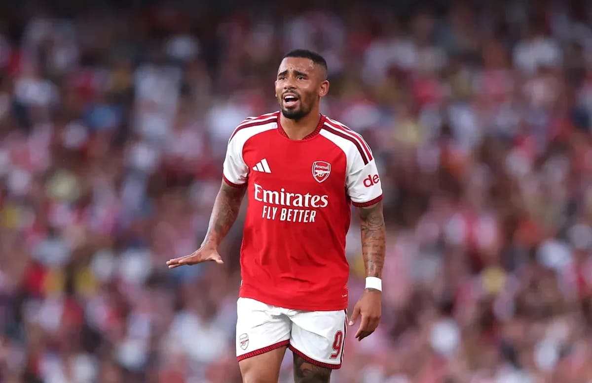 Arsenal player gesturing during match at stadium