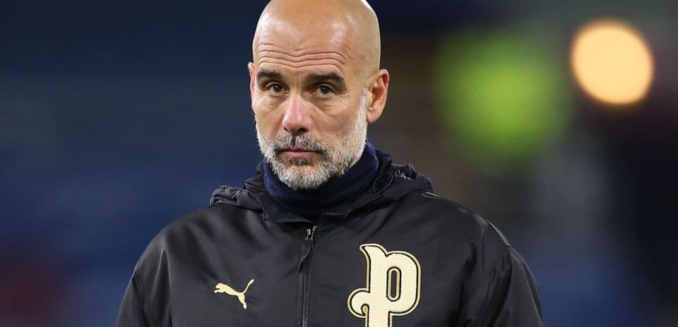 Coach in black jacket during match preparation
