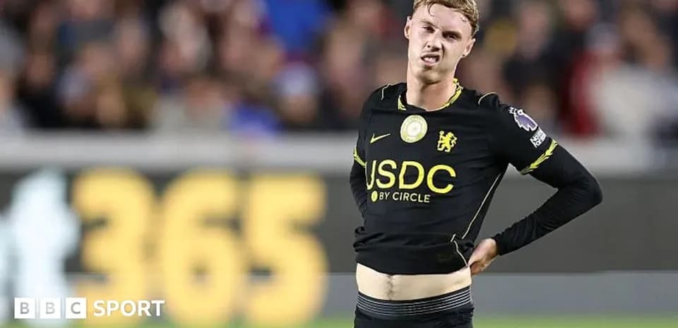 Player in black jersey showing frustration on field