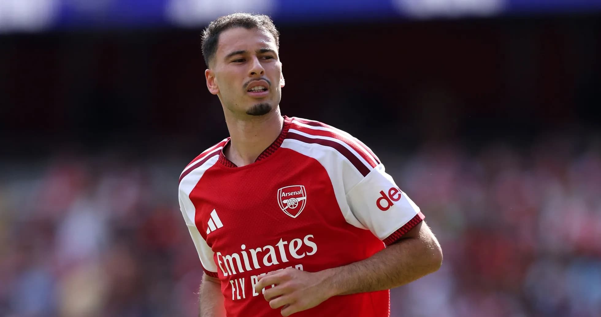 Player in Arsenal jersey during match warm-up