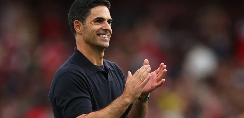 Coach applauding during a match on the sidelines