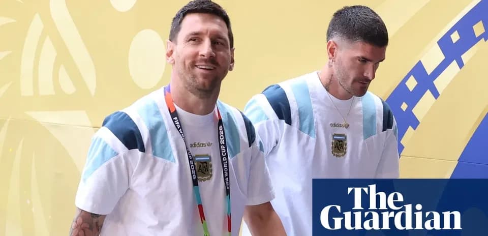 Two players in Argentina jerseys entering venue