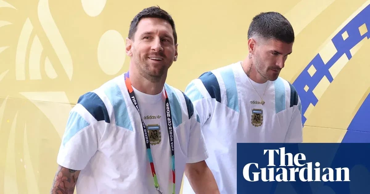 Two players in Argentina jerseys entering venue