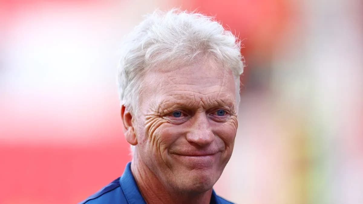 Manager smiling during pre-match warm-up