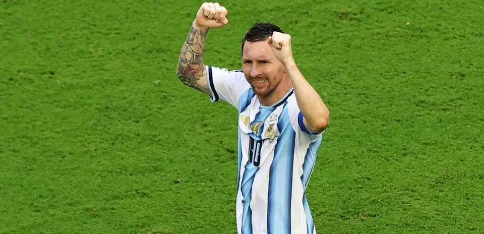 Player celebrating on the field with raised fists
