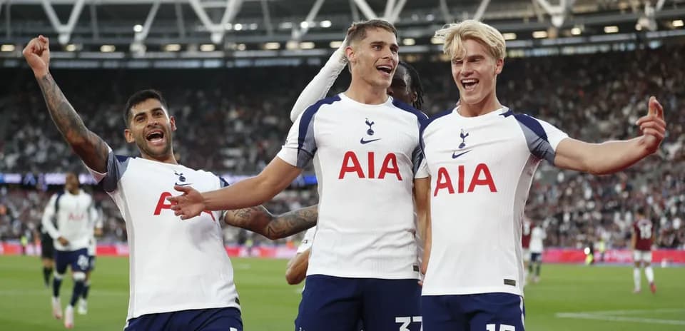 Tottenham players celebrating a goal on the field