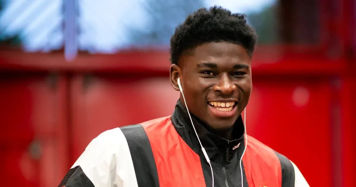 Player smiling while wearing headphones indoors