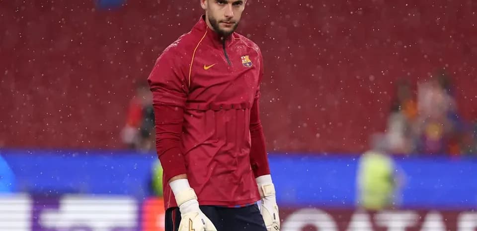 Goalkeeper in training gear during rainy conditions