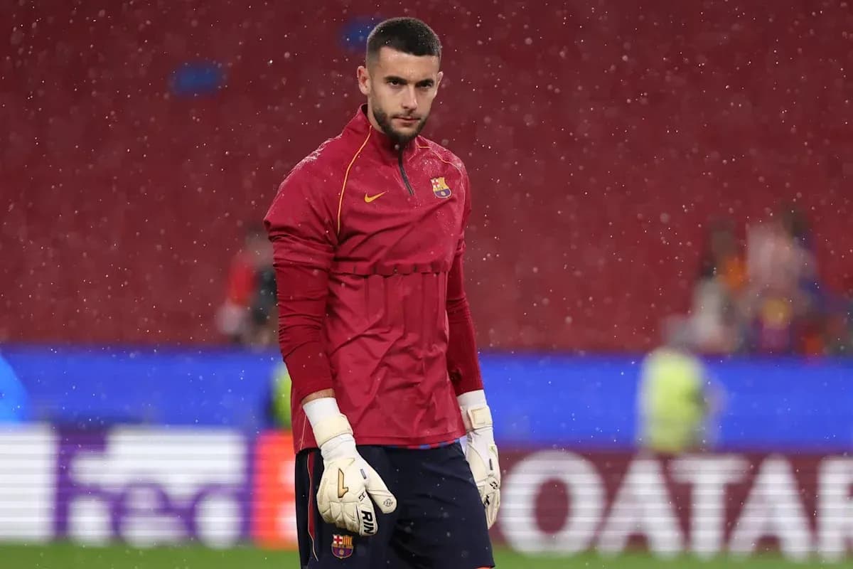 Goalkeeper in training gear during rainy conditions