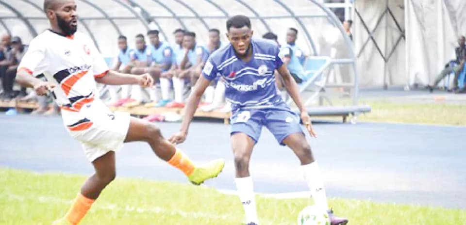 Player dribbling during Rivers United match
