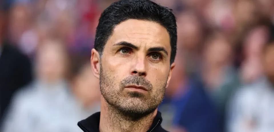 Manager focused during match on sidelines