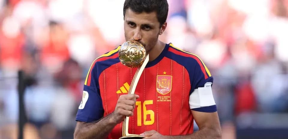 Player holding trophy after winning match