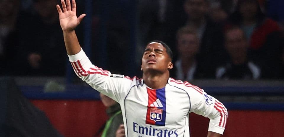Player celebrating with arms raised during match