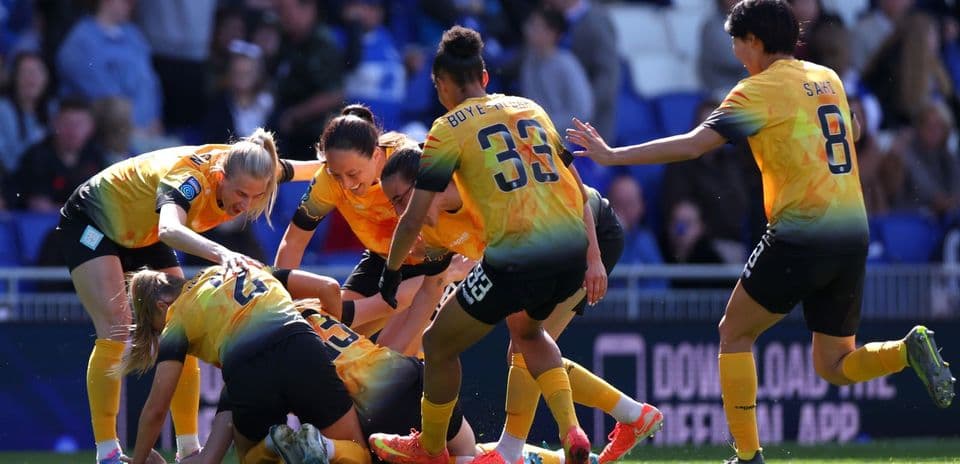 Players celebrating after scoring a goal