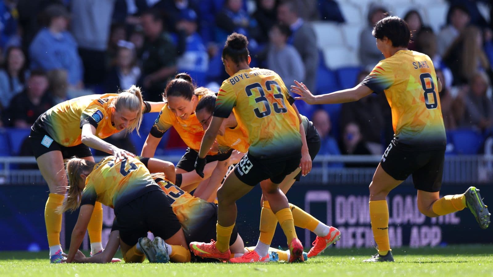 Players celebrating after scoring a goal