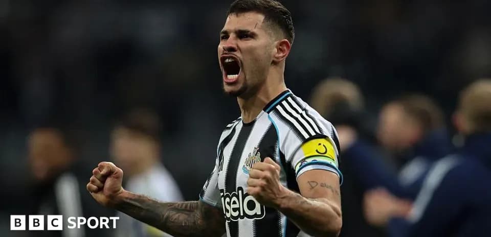 Newcastle player celebrating with raised fists