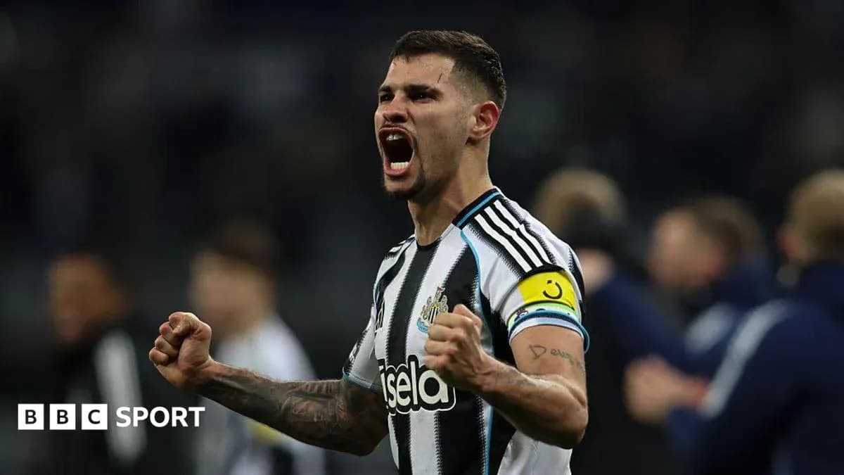 Newcastle player celebrating with raised fists