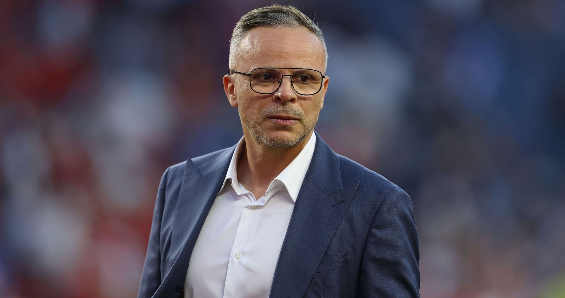 Coach in a suit during a match event