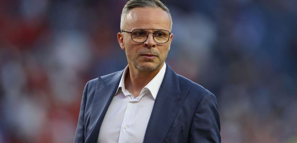 Coach in a suit during a match event