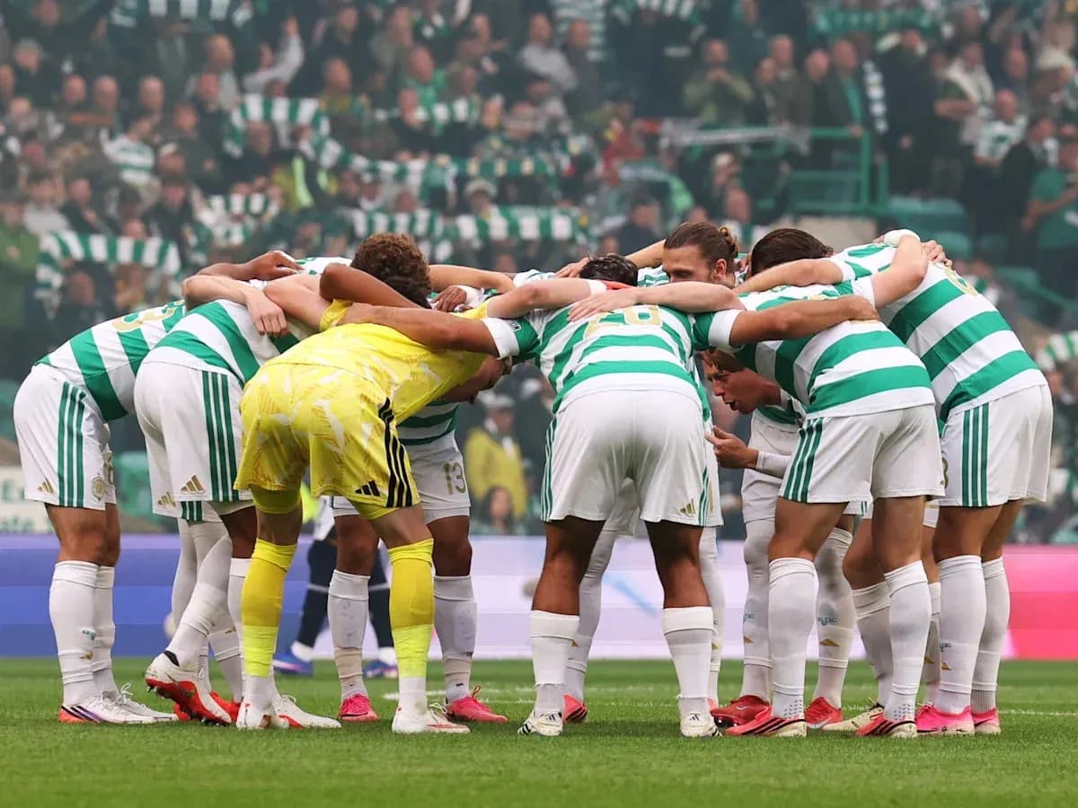 Celtic players huddled together before match