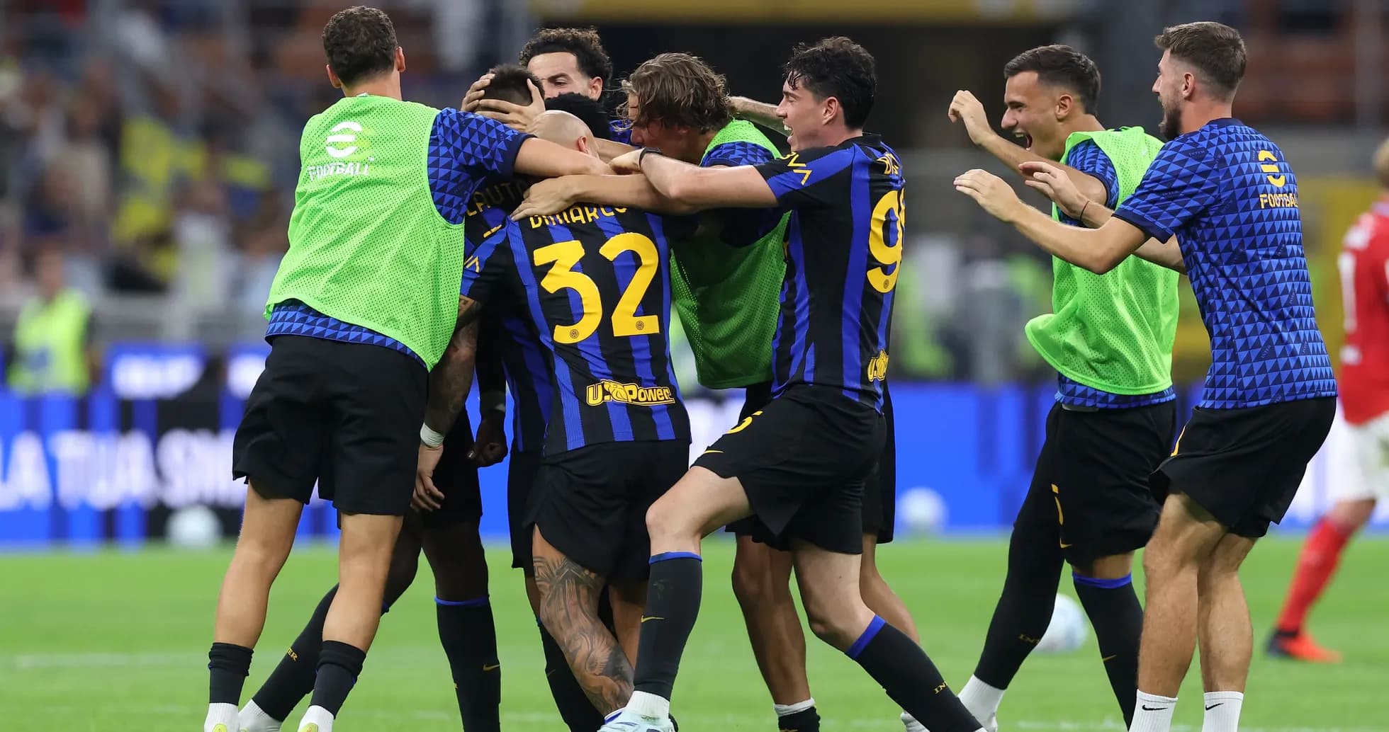 Players celebrating a goal on the field
