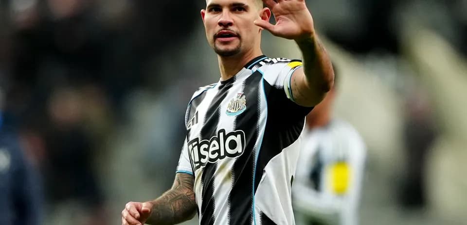 Newcastle player gesturing to fans during match
