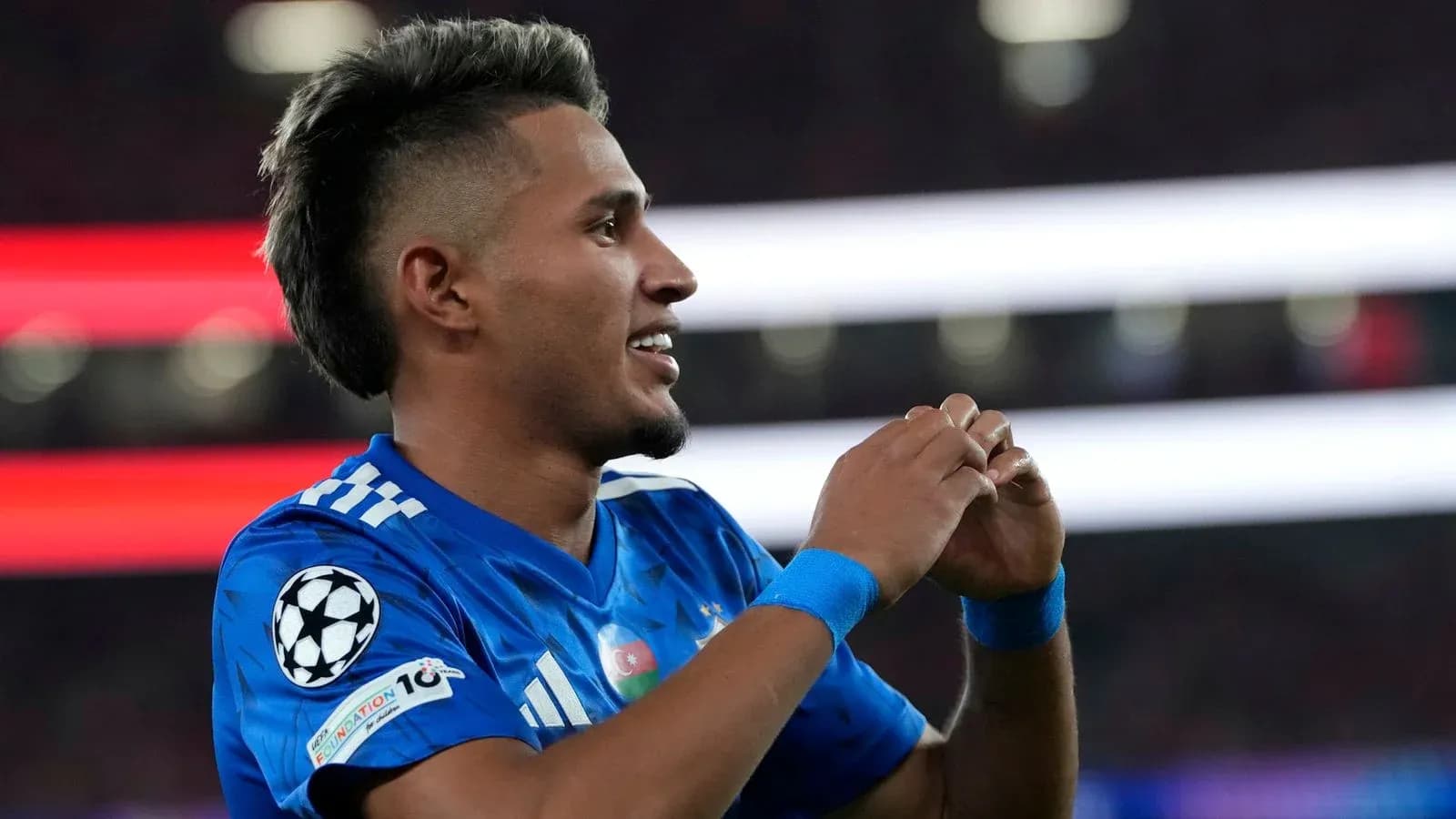 Player celebrating during UEFA Champions League match