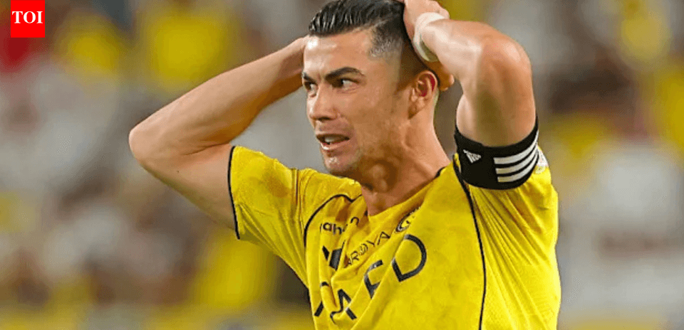 Player in yellow jersey holding head in frustration