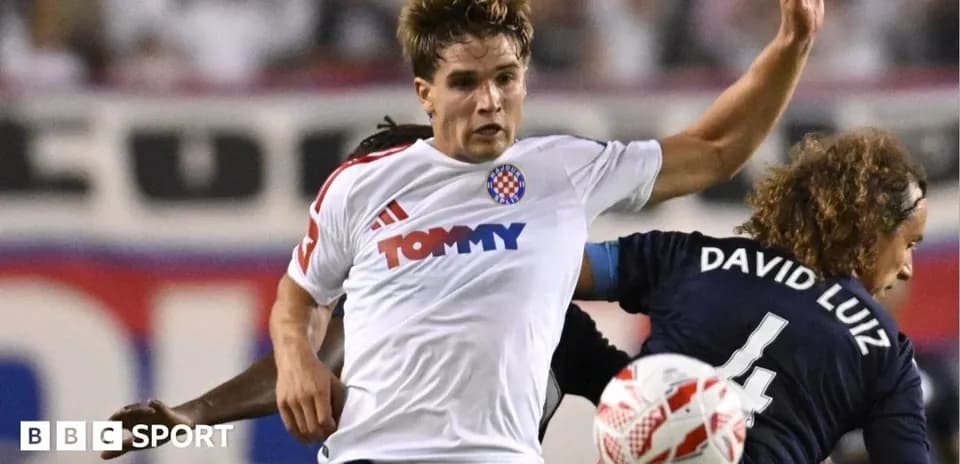 Player challenging opponent during a football match