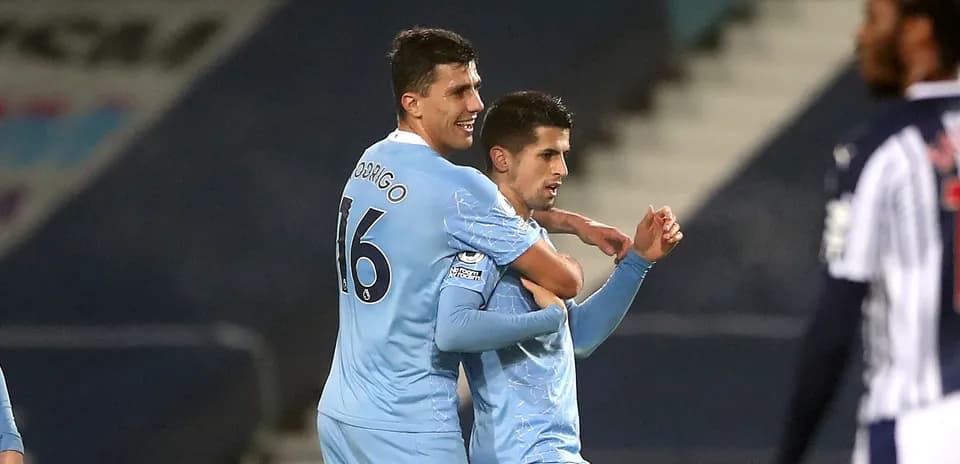 Two players celebrating after scoring a goal