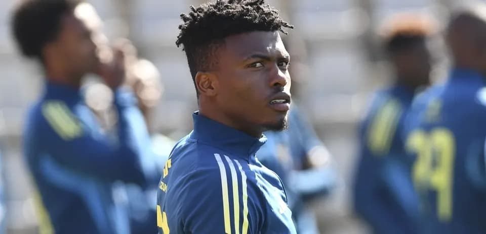 Player observing during training session with teammates